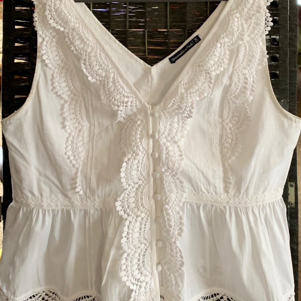 Never worn. White short sleeve top.